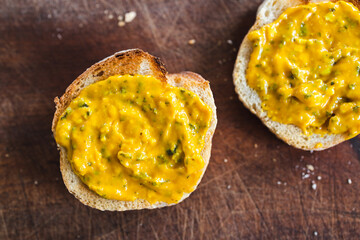 simple food ingredients, bread slices with sweet potoato and kale dip