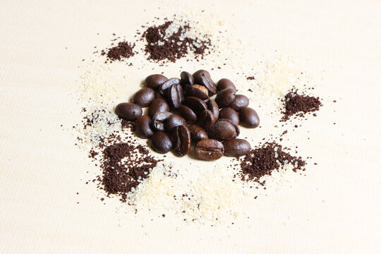 Coffee beans sugar and creamer on wood background © nitinut380