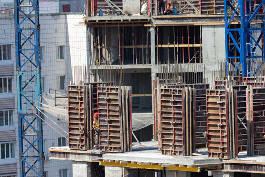 Noisy Construction Site In The Middle Of The City. Building New High-rise. Assembling Monolite House