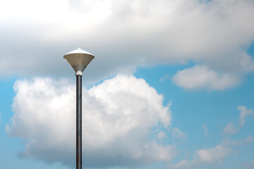 street lamp against blue sky