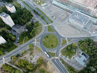 Fototapeta na wymiar Aerial view panoramic landscape of Moscow city at sunrise. Multi-level intersection on an expressway in the city in the rays of the golden sun. Drone shot