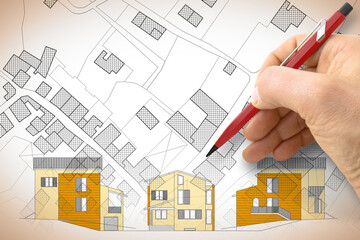 Architect drawing a new residential building over an imaginary cadastral map of territory
