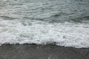 Wave in the sea with splashing water.