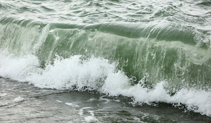 Wave in the sea with splashing water.