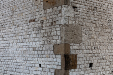 Corner of a brick wall of an old ancient building in Poland