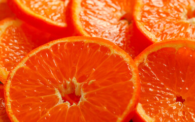 Juicy tangerine, cut into rings close-up. Background of ripe citrus fruits .