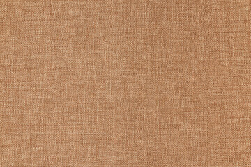 Texture canvas fabric as background light brown. Small texture