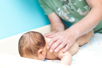 Fototapeta na wymiar Baby massage, close up shot. Child massage, newborn.