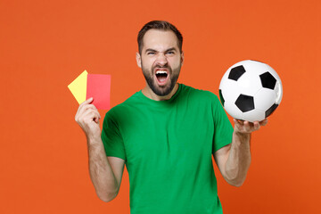 Irritated man football fan in green t-shirt support favorite team with soccer ball propose player...