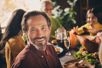 Closeup photo of full family gathering bristled father wife toothy beaming smiling wait make first toast harmony atmosphere served dinner big table generation in evening living room indoors