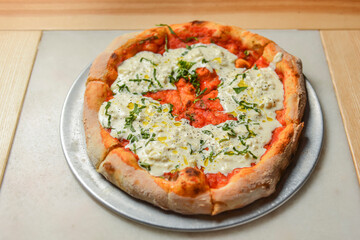 Fresh italian classic original Pepperoni Pizza served on wooden table. Italian cuisine.