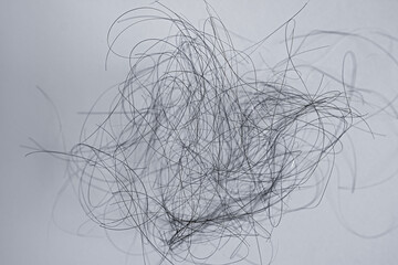 fallen out hair of a woman, black and gray