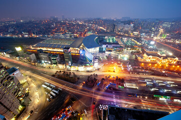 Fototapeta na wymiar The wonderful night view of cityscape and car light.