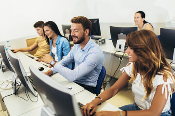 College students in a computer lab, using computers during class.