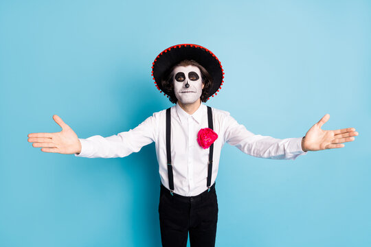 I missed you darling. Photo of cute undead creature guy death day concept creepy makeup open hugs arms wait dead bride catrina wear latin spanish hat costume isolated blue color background