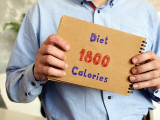 Weightloss concept about diet 1800 calories with sign on the page.