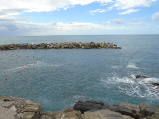 Cinque Terre, Italy - 08/31/2020: Beautiful landscape of a coastal fishing village, amazing view on many little colorful houses, traditional architecture of the little Italian town called Cinque Terre