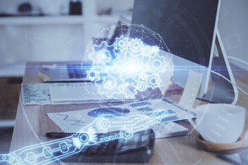 Double exposure of desktop computer and technology theme hologram. Concept of software development.