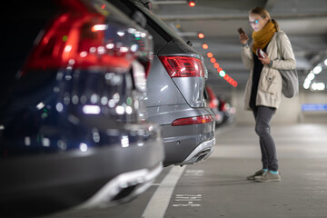 Underground garage or modern car parking with lots of vehicles, perspective © lightpoet