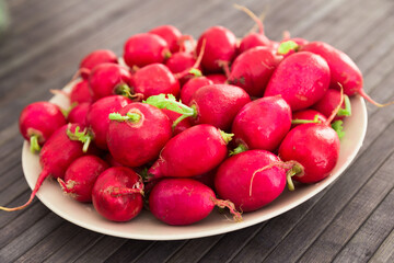 appetizing crispy radishes on wooden table