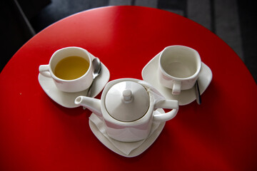 still life with coffee service breakfast on a red tablecloth