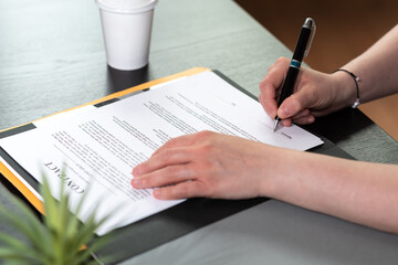 Businesswoman signing a document
