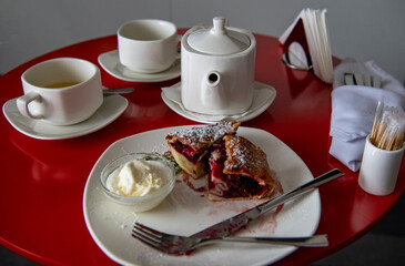 still life with coffee service breakfast on a red tablecloth