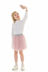 The girl is using a cell phone.The concept of people and technology.