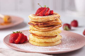 Delicious, only baked pancakes with fresh aromatic strawberries