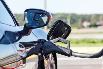 Electric Car charge with cable in fast charging station