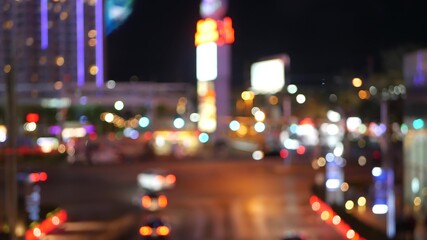 Defocused fabulous Las Vegas Strip boulevard, luxury casino and hotel, gambling area in Nevada, USA. Nightlife and traffic near Fremont street in tourist money playing resort. Neon lights of sin city