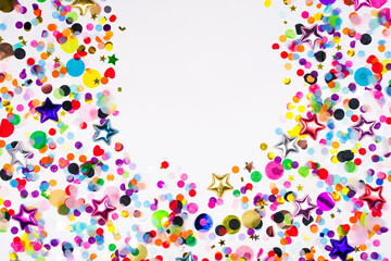 Colorful paper and foil round, star confetti oval border. Party template on white background, copy space. luxury festive holiday card clipart. New year, birthday, wedding, christmas flat lay frame
