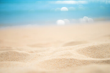 Fototapeta na wymiar Blur tropical beach with bokeh sun light wave abstract background.