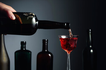 Aged golden fortified sherry being poured into a crystal glass.