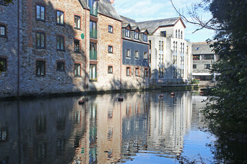 Fototapeta na wymiar Buildings reflected in the River Dart at Totnes 