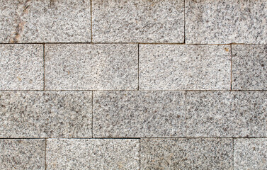 Fototapeta premium road paved with sidewalk tiles. texture of light gray bricks.