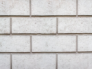 Obraz premium road paved with sidewalk tiles. texture of light gray bricks.