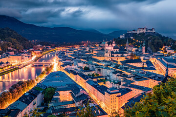 Gloomy morning cityscape of Salzburg, Old City, birthplace of famed composer Mozart. Framatic spring scene of Eastern Alps.Splendid  landscape with Salzach river. Traveling concept background.