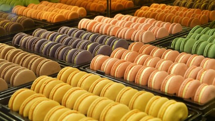Trays with colorful macaroons. Metal trays with delicious colorful macaroons placed on stall in cafe