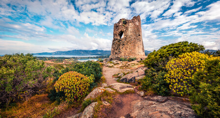 Splendid spring scene of Torre di Porto Giunco tower on Carbonara cape. Stunning morning view of...