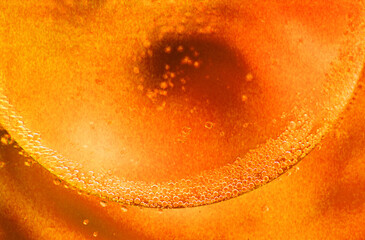 Obraz premium abstract light orange background with oil circles . oil bubbles of water close up. fiery circle bubbles background