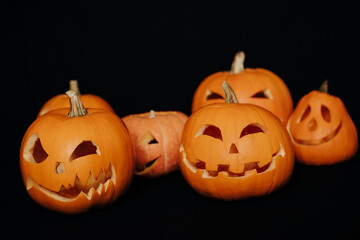 decorative orange Halloween pumpkins with carved faces