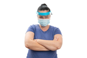 Woman with crossed arms wearing medical mask and face shield