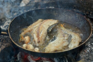 The preparation of the fish caught on fire.
