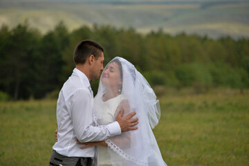 a young couple celebrates their wedding anniversary in the latter on self-isolation, they laugh, play and have fun