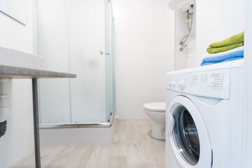 Modern white washing machine front panel with display