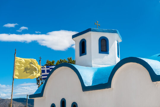 The lement of traditional greek orthodox church with blue roof and white walls, 