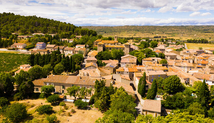 Fototapeta na wymiar Scenic aerial view of French township of Fontcouverte at foot of Alaric mountain on sunny summer day, Aude, Occitanie..