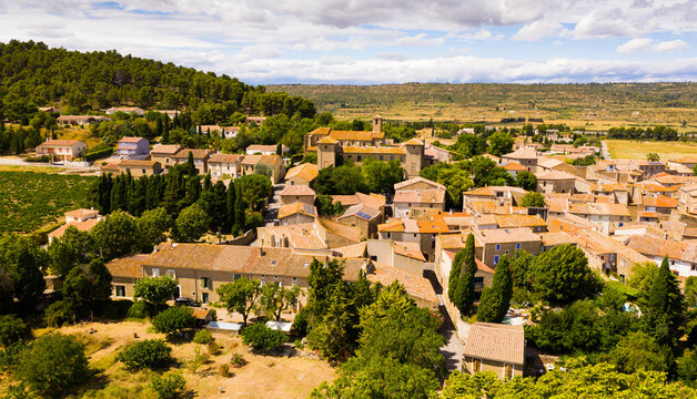 Scenic aerial view of French township of Fontcouverte at foot of Alaric mountain on sunny summer day, Aude, Occitanie..