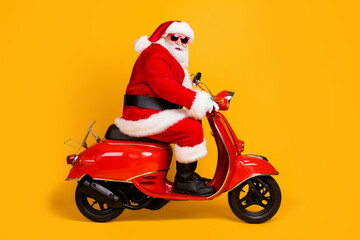 Profile side view of his he nice funny fat thick white-haired Santa riding motor bike travel trip...